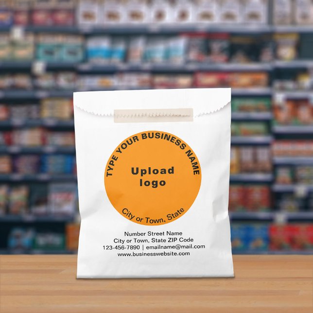 Orange Round Business Brand on Paper Bag (Paper bag with orange round business branding displayed in a store)