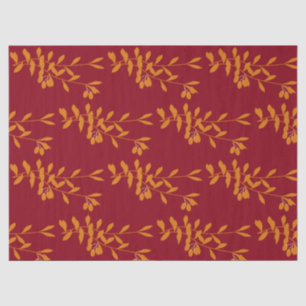 Orange silhouette branch leaves on red tissue paper