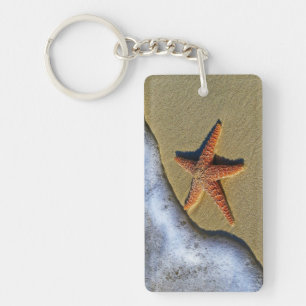 Orange starfish at the beach key ring
