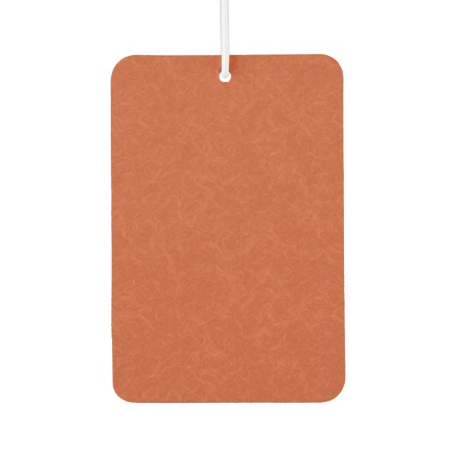 Orange textured surface with swirling pattern car air freshener (Front)