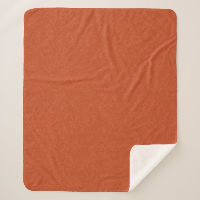 Orange textured surface with swirling pattern sherpa blanket (Front)