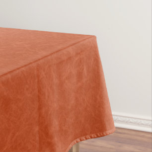 Orange textured surface with swirling pattern tablecloth