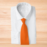 Orange Tiger Solid Colour Tie<br><div class="desc">Orange Tiger Solid Colour. This bold and energetic hue captures the spirit of vibrancy and excitement. It's an intense, almost electric orange with just the right amount of warmth and brightness. Its boldness makes it a standout colour that is sure to capture attention. This dynamic hue works beautifully with a...</div>