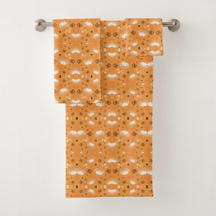 Orange towels and washcloth with a cute sheep