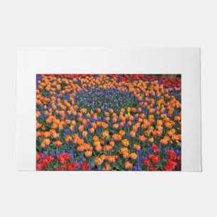 Orange tulips and muscari flowers doormat