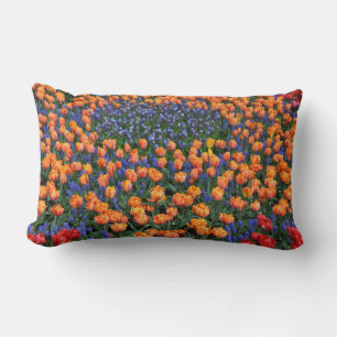 Orange tulips and muscari flowers lumbar cushion