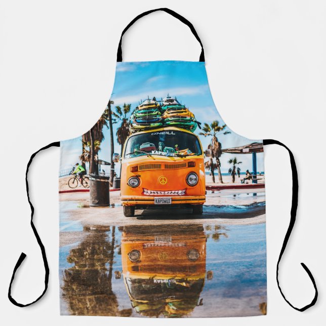Orange van with surfboard on top apron (Front)