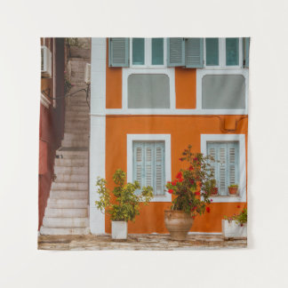 ORANGE WHITE AND GRAY CONCRETE BUILDING TAPESTRY