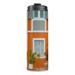 ORANGE WHITE AND GRAY CONCRETE BUILDING THERMAL TUMBLER