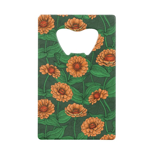Orange Zinnia flowers, green leaves on dark green (Front)