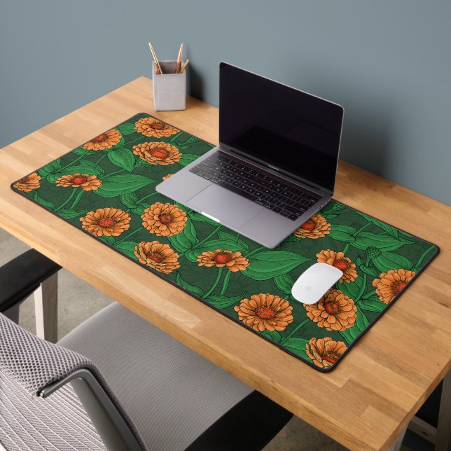 Orange Zinnia flowers, green leaves on dark green Desk Mat (Office 2)