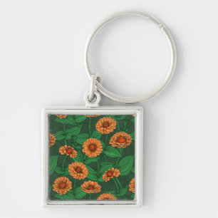 Orange Zinnia flowers, green leaves on dark green Key Ring