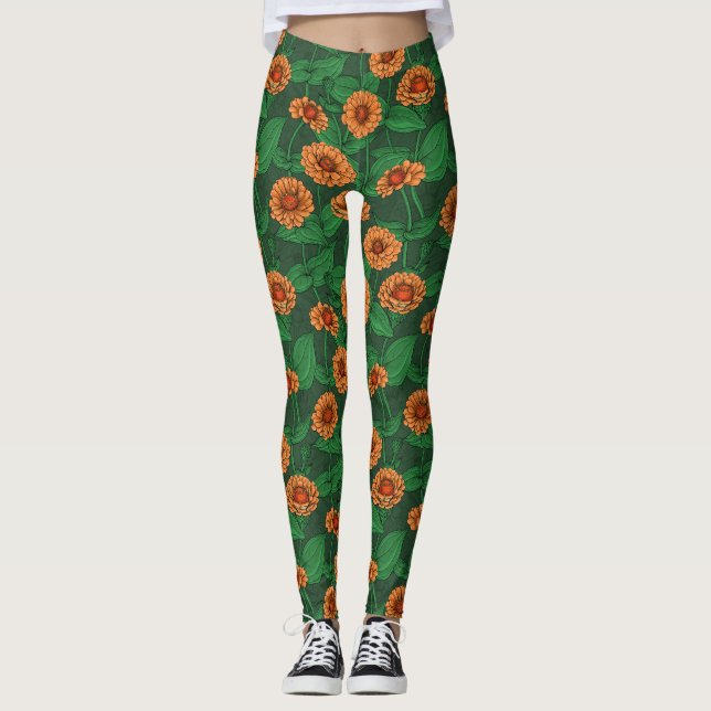 Orange Zinnia flowers, green leaves on dark green Leggings (Front)