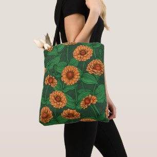 Orange Zinnia flowers, green leaves on dark green Tote Bag