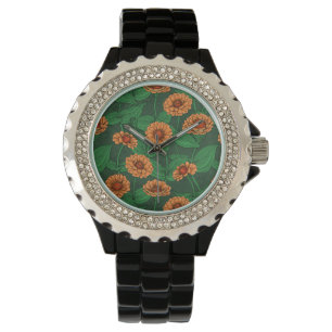 Orange Zinnia flowers, green leaves on dark green Watch