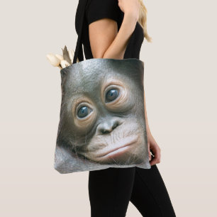 Orangutan Baby Clinging To His Mother Tote Bag