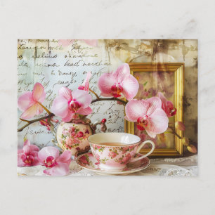 Orchids alongside a teacup and picture frame postcard