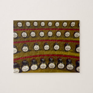 Organ stops jigsaw puzzle in a tin