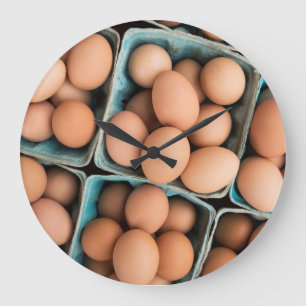 Organic eggs in crates large clock