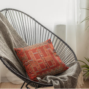 Oriental rug design in  bright oranges  cushion