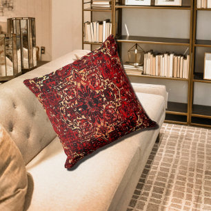 Oriental rug design in dark red cushion