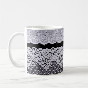 Ornamental white lace, isolated black background. coffee mug