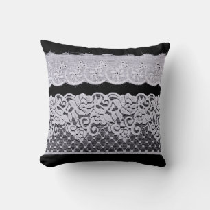 Ornamental white lace, isolated black background. cushion