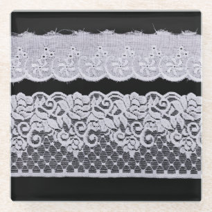 Ornamental white lace, isolated black background. glass coaster
