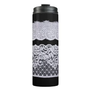 Ornamental white lace, isolated black background. thermal tumbler