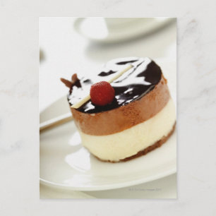 Ornate cheesecake on plate with coffee cup in postcard