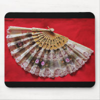 Ornate Hand Held Fan on a Red Background