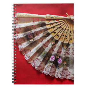 Ornate Hand Held Fan on a Red Background Notebook