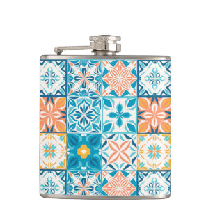 Ornate tiles in blue and orange hip flask
