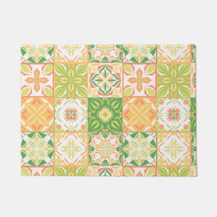 Ornate tiles in green and yellow doormat