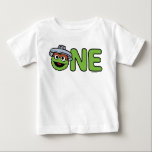 Oscar the Grouch First Birthday Baby T-Shirt<br><div class="desc">Celebrate your little one’s first birthday with this adorable Sesame Street baby t-shirt featuring Oscar the Grouch! This playful design showcases Oscar with his signature grumpy smile, popping out of his iconic trash can, along with bold "1st Birthday" text. Soft and comfortable, this t-shirt adds a fun and whimsical Sesame...</div>