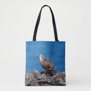 Osprey on the rocks tote bag