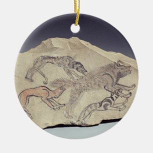 Ostracon depicting a dog chasing a hyena (limeston ceramic ornament