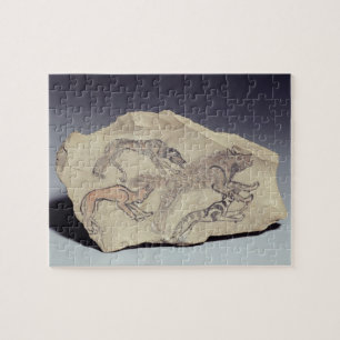Ostracon depicting a dog chasing a hyena (limeston jigsaw puzzle