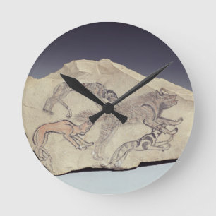 Ostracon depicting a dog chasing a hyena (limeston round clock