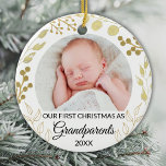 Our First Christmas As Grandparents Gold Photo Ceramic Ornament<br><div class="desc">This elegant Grandparents Christmas Ornament is decorated with gold foliage on a white background.
Easily customisable with baby's photo and year.
Original Watercolor © Michele Davies.</div>