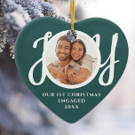 Our First Christmas Engaged Photo Heart-Shaped Ceramic Ornament<br><div class="desc">This keepsake festive green heart-shaped First Christmas Engaged photo ceramic ornament is decorated with the word JOY in stylish white script typography. Easily customisable.</div>