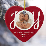 Our First Christmas Engaged Photo Red Heart-Shaped Ceramic Ornament<br><div class="desc">This keepsake red heart-shaped First Christmas Engaged photo ceramic ornament is decorated with the word JOY in stylish white script typography. Easily customisable.</div>