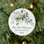 Our First Christmas Watercolor Greenery Ceramic Ornament<br><div class="desc">Modern Elegant Watercolor Greenery Couple Our First Christmas Ornament includes beautiful watercolor botanical greenery,  eucalyptus leaves other beautiful foliage.</div>