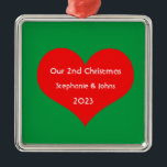 Our Second Christmas Together Cute Red Heart 2023  Metal Ornament<br><div class="desc">Personalised names and printed with cute red heart design in solid green background. Feel free to customise by adding your own texts,  names or photos. You can add your photo on the back side of the ornament easily!
The colour of the background can also be changed as you want.</div>