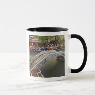 Outdoor cafe along River Walk and bridge over 2 Mug