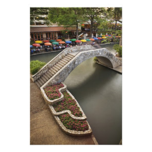 Outdoor cafe along River Walk and bridge over Photo Print