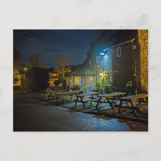 Outside the oldest pub in town at night time postcard