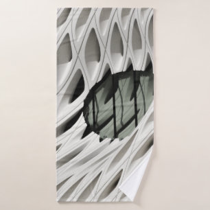 Oval black tint glass panel on white surface bath towel