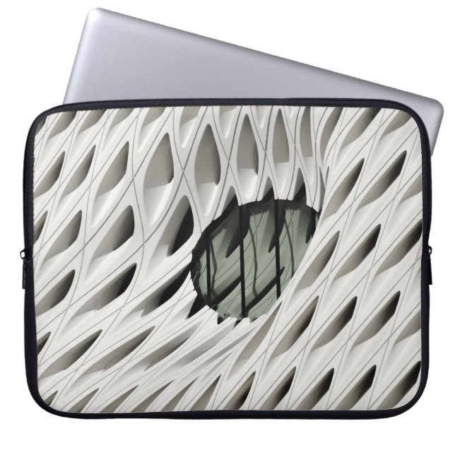 Oval black tint glass panel on white surface laptop sleeve (Front)