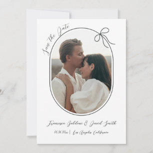Oval photo with thin border and a minimal bow save the date